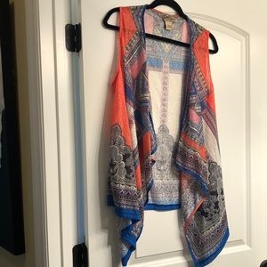 Sleeveless vest-style top. Kimono-like. Like New!